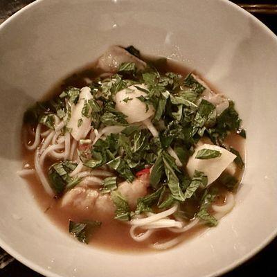 Chili galangal consommé with shrimp and fish balls