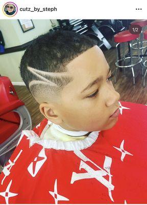 Mid skin fade with a design