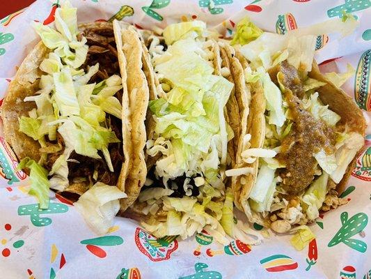 L to R: Barbacoa Taco with lettuce, Carne Molida Taco with cheese and lettuce, and Pollo Taco with lettuce cheese and medium sauce