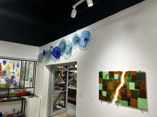 Glass pieces hanging around the studio