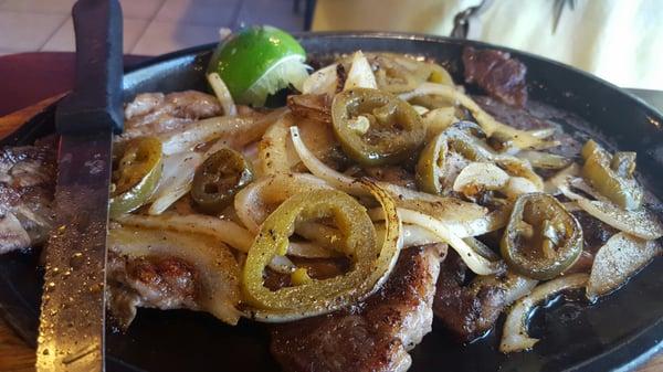 Carne Asada. Steak with grilled onions and peppers.