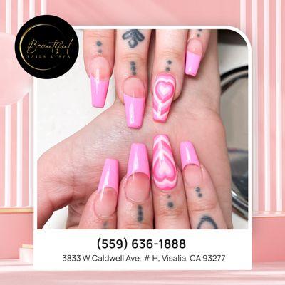 Heart eyes for these adorable pink French tips with delicate heart accents.