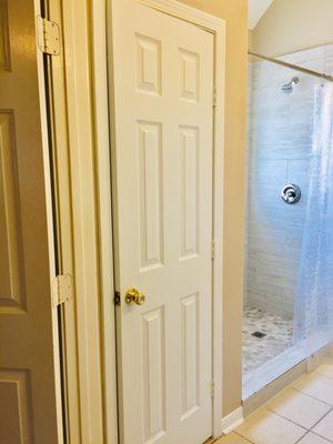 Closet door and created a new shower where old bathtub was before