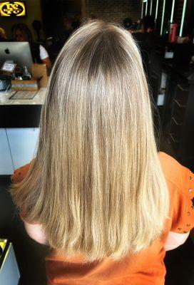 Natural looking highlights done with a combination of balayage and highlights to create a low maintenance brighter look.