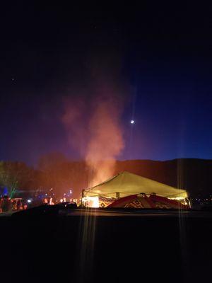 This is the back view of our tent and merch set up...I just love the colors and the smoke that the bonfire is Making. Very Sexay