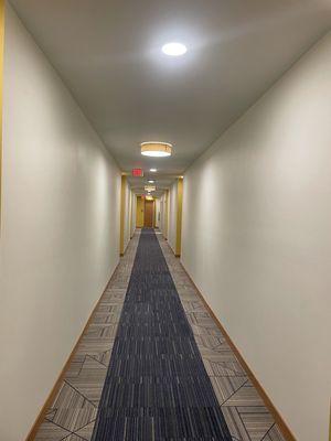 Fresh new hallway with off white and yellow accents