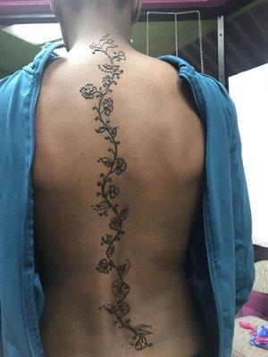 Henna tattoo at the back..