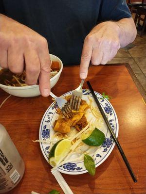 No knives at the table but I person-handled this large- bigger than bite-sized piece of chew love with a couple of available forks.