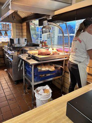 Don't those rolls look appetizing under the meat table? Uncovered pots, filthy floor, overflowing garbage can, dirty tongs, etc.