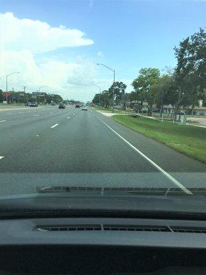 Heading southbound on Dale Mabry Hwy. It can be tricky to find the correct driveway. It's the 4th one after the overpass.