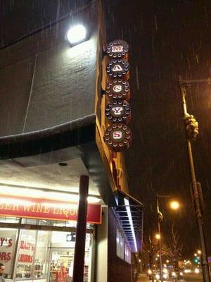 Store entrance street view sign on a snowy night