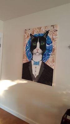 Interesting art...a tuxedoed cat with a travel pillow? So hot and hungry, who knows? (8/4/17) Learned later it was Opus the Cat.