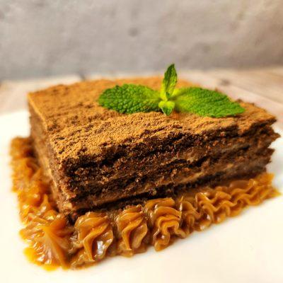 Chocotorta  made with layers of chocolate cookies soaked in coffee and filled  with a creamy mixture of dulce de leche and cream cheese.