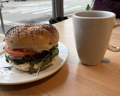 Bagel with whitefish salad sandwich and coffee