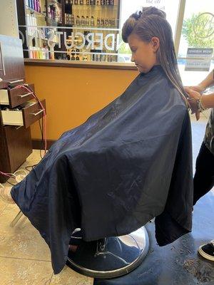 Enjoying her hair cut. Snip Snip.