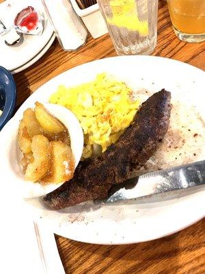 Left to Right, Fried Apples, eggs, grits and Skillet Sirloin Steak