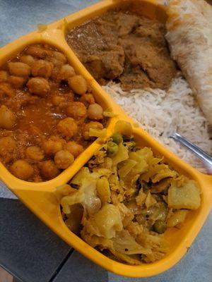 Chicken mandala with chickpeas, Naan, rice, and vegetables