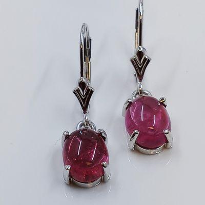 Pink Tourmaline cabochon set in 14k white gold lever back style earring.