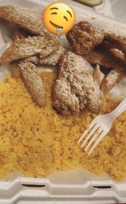 Fried chicken wings and yellow rice