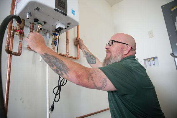 Our technician manager, Lewis, installing a new tankless water heater.  Call Castroville Plumbing for all of your plumbing needs!