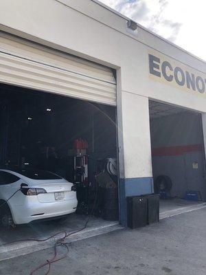 Tesla Charging up during the Tire fix! Isn't that a 5 stars experience!