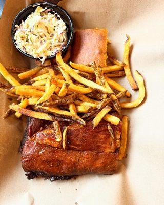 Baby back ribs with cold slaw and fresh cut fries and cornbread.