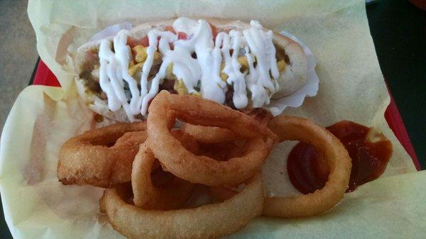 Sonoran dog with way to much mayc or crema, what ever is on top. Onion rings were not bad at least.