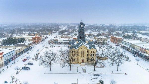 The Historic Granbury Square blanketed in snow.