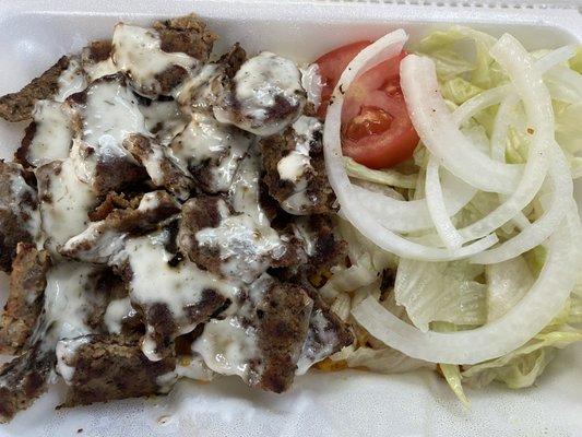 lamb over rice with salad