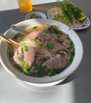 large brisket, tendon, tripe, side of peppers and sprouts, cilantro.