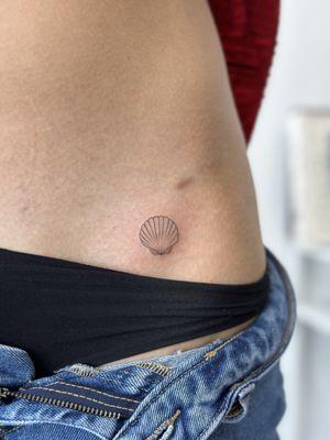 Single needle seashell tattoo