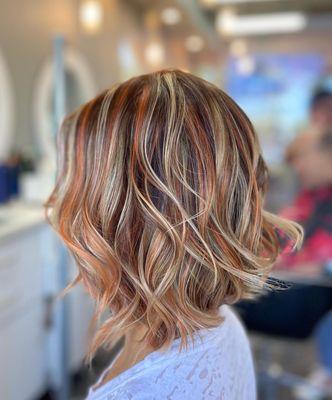 Copper and light blonde highlights mix with coffee blonde base by Joyce