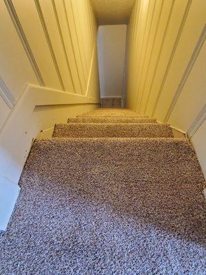 Carpet installation on stairs.