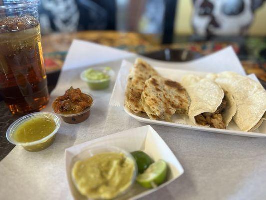 Chicken Caramelo + chicken tacos & Iced Tea looks like fire, roasted salsa, avocado sauce, spicy green avocado salsa, green salsa