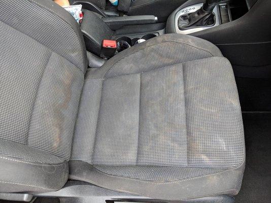 Front passenger seat after I got the car back. Dirt and soap residue.