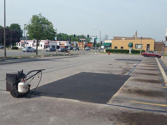 Asphalt Patching and Hot tar crack filling the joints