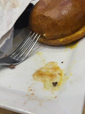 The raw egg from the burger