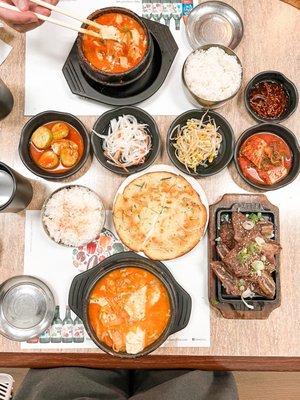 Seafood tofu, pork and kimchi tofu soup, Galbi and banchans.