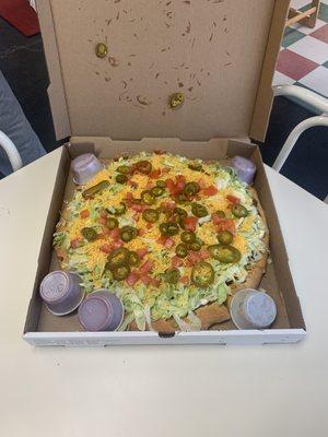 Service was great. THIS TACO PIZZA WAS THE RESULT. I travel from out of town in Alexandria just for this.