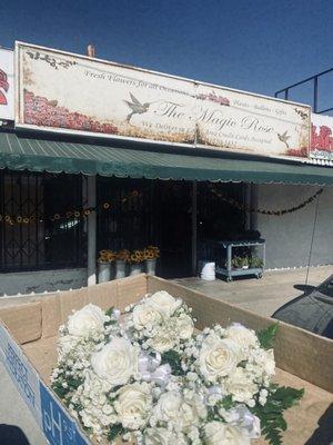 Store front and girls hand corsages