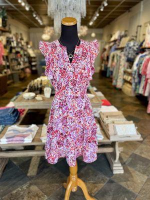 This gorgeous summer dress is lightweight and so flattering! We love this fun boho pattern with bright colors.