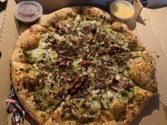 Large B-Ripp Pizza- pesto, artichoke, sausage, sun-dried tomato, and mushroom.