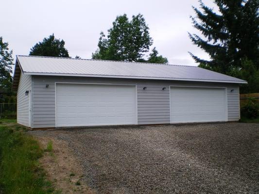 30'x60' shop and garage with double car garage doors.