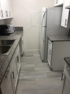 Kitchen with Refrigerator installed but no dishwasher!