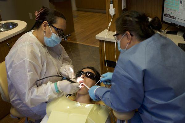 Dr. Tawfik and her assistant working on a patient.