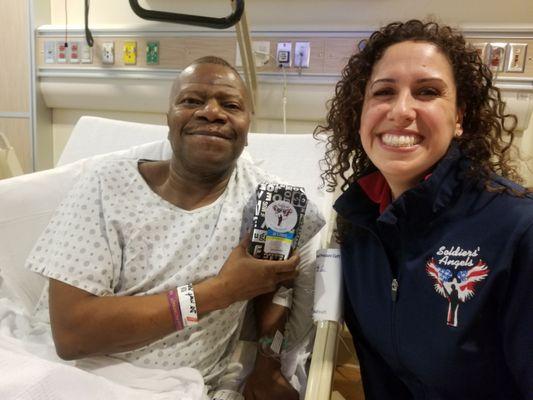 Soldiers' Angels volunteer visiting a Veteran patient in a VA Hospital.