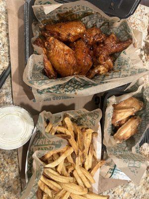 Korean BBQ and Plain wings, fries, and Ranch dipping sauce.