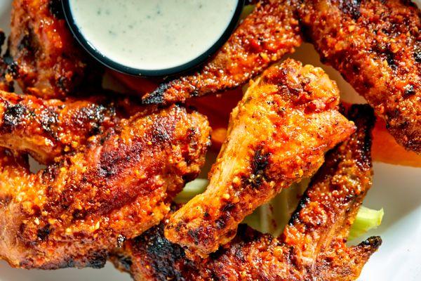 Wood-fired wings! These  locally sourced wings are amazing. Don't forget a house made dip to go with it!