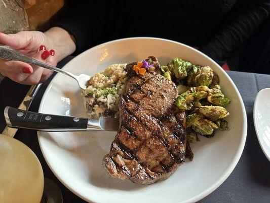 Ribeye with mushroom risotto and fried brussel sprouts.