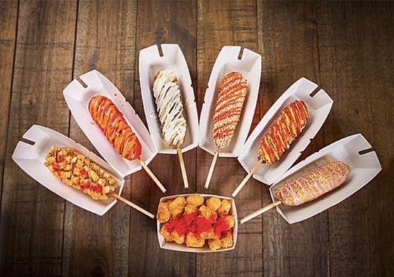 Potato dog, spicy dog, two hands corn dog, crispy rice dog, classic dog and injeolmin dog.